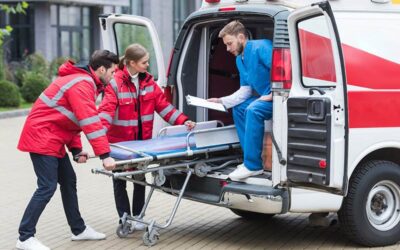 NIBA Ancilliary Products. Paramedics moving out ambulance stretcher from car.